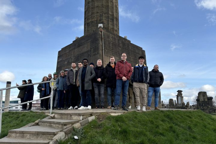 a group of people standing in front of a building