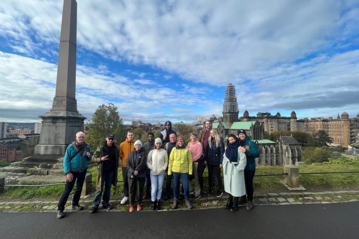 a group of people standing in front of a building