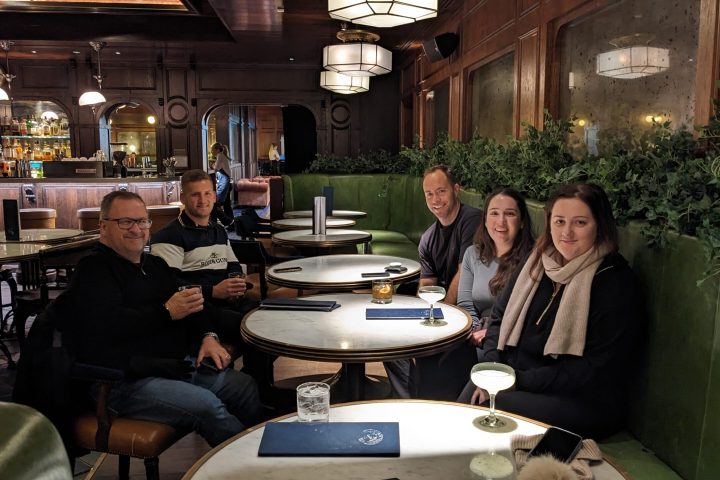 a group of people sitting at a table in a restaurant