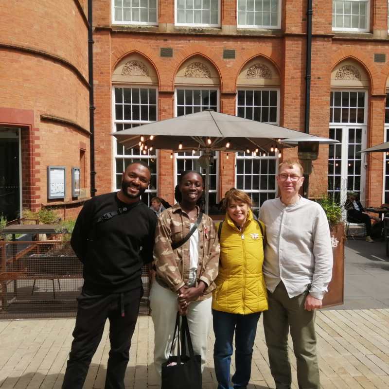 a group of people standing in front of a building