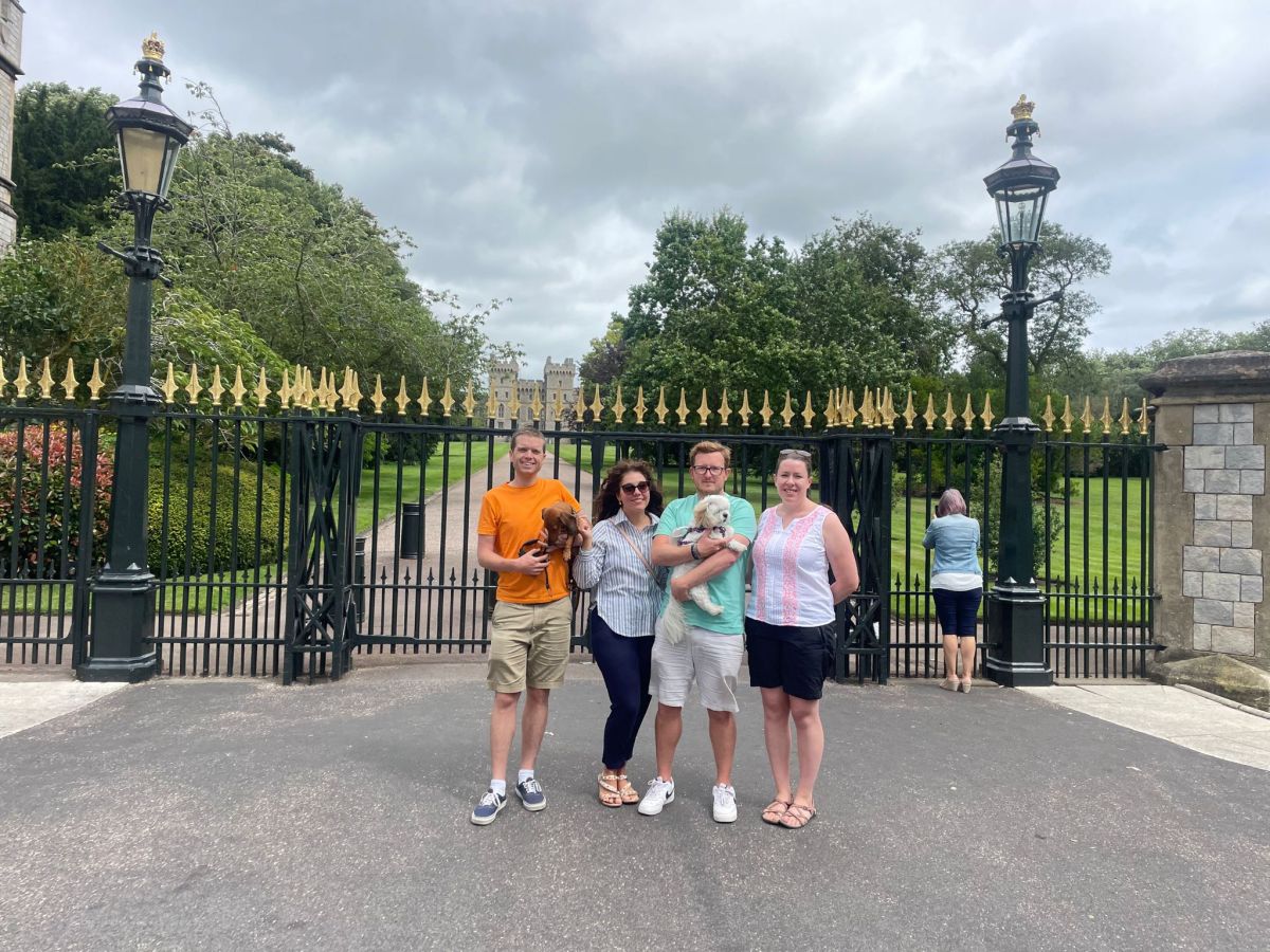 a group of people standing in front of a building