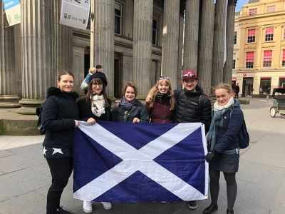 a group of people standing in front of a building