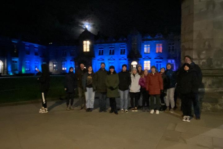 a group of people standing in front of a building