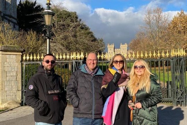 a group of people standing in front of a building