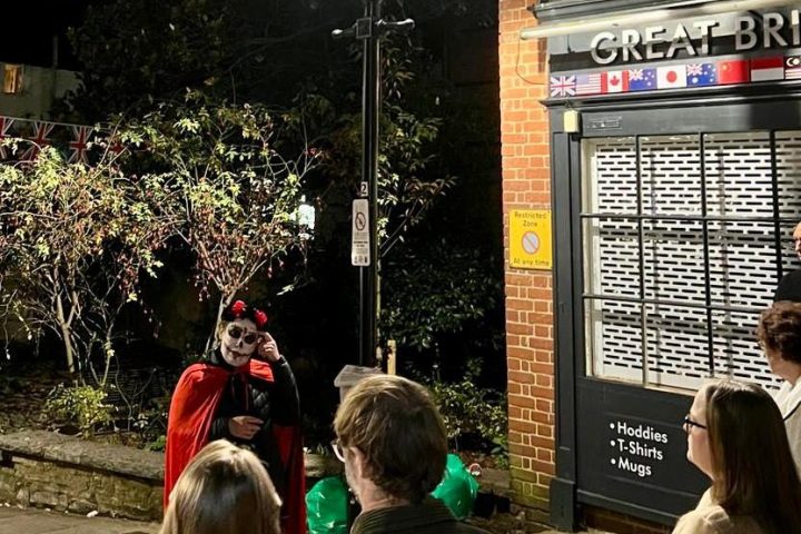 a group of people standing in front of a building