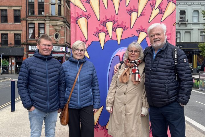 a group of people standing in front of a building