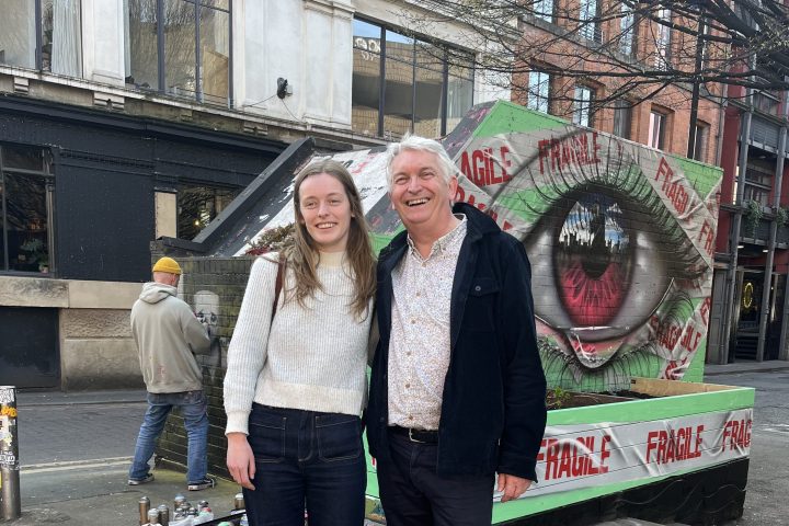 a woman standing in front of a building