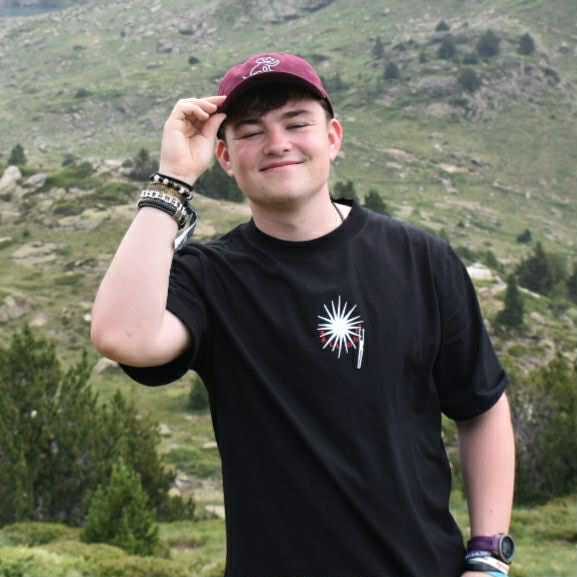 a man standing on top of a mountain
