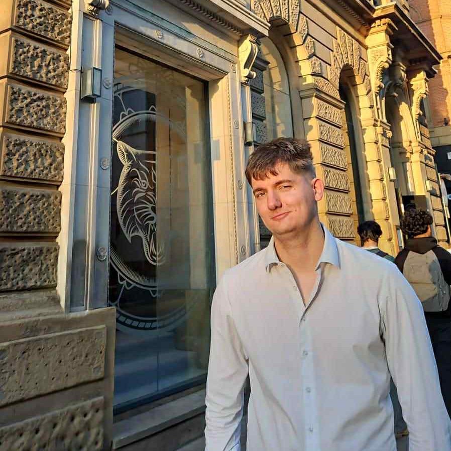 a man and a woman standing in front of a building
